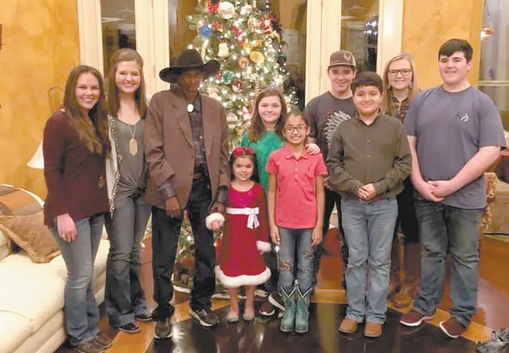 Christmas at the home of Jason Talley’s family just wouldn’t be the same without Jed Malloy (third, from left), who joins in the festivities with (from left) Ashlynn Meyer, Mikaela Talley, Amelia Talley, Macie Talley, Leah Rodriguez, Wyatt Talley, Travis Rodriguez, Heather Keylich, and Carson Talley. COURTESY
