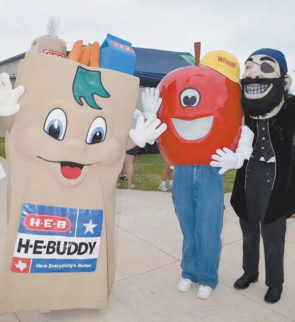 H-E-Buddy (l-r) visits May 2 with Wilson, the Wilson County News’ Newspapers In Education mascot, and the Poth Pirate mascot, at the Poth Special Relays. Participants with special needs enjoyed modified track and field activities. COURTESY/Poth ISD
