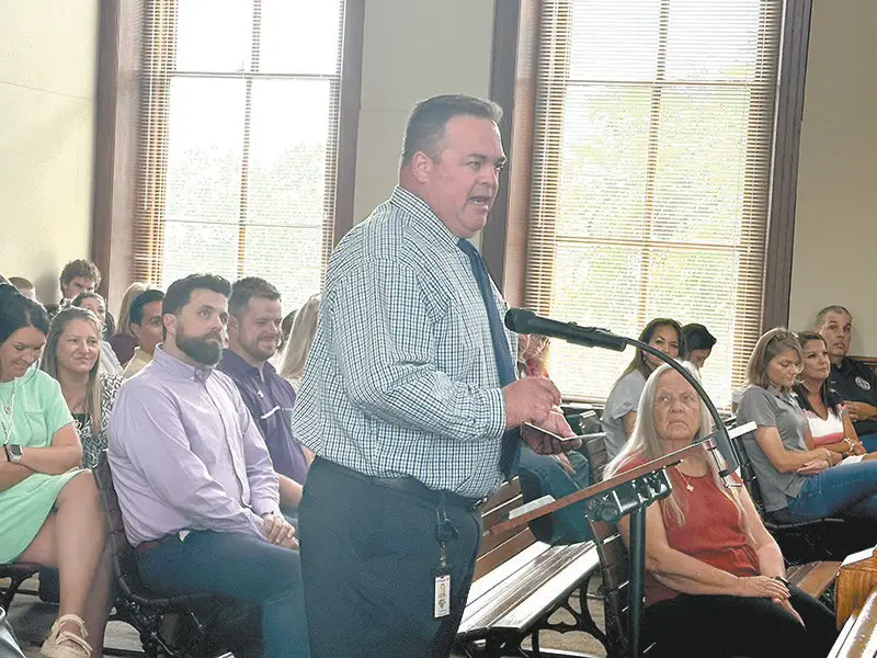 Stockdale Independent School District Superintendent Todd Deaver addresses the Wilson County Commissioners Court June 9 in favor of a tax abatement zone for a solar farm in eastern Wilson County. Some area residents voiced their opposition to the project. RACHEL DRAPER/Wilson County News